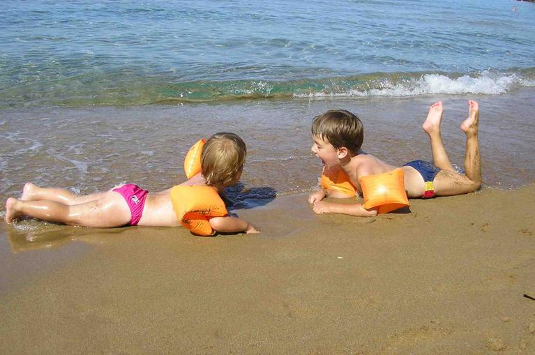 kids playing in the beach