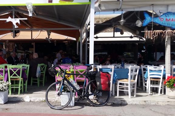 Bike parked in front of a restaurant in Evia