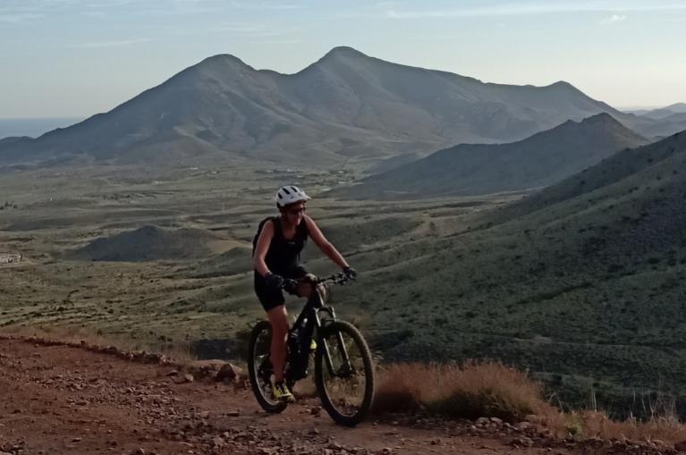 Woman cycling Cabo de Gata