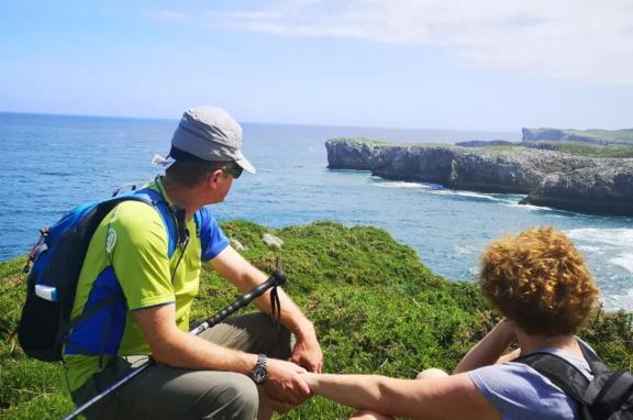 Hikers looking at the Cantabrian Sea in the bufones de Pria