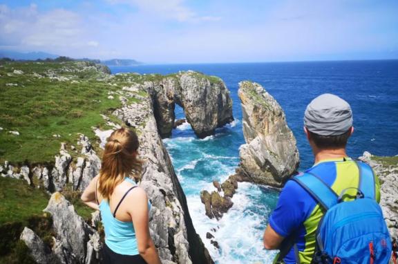 Hikers looking at the Cantabrian Sea