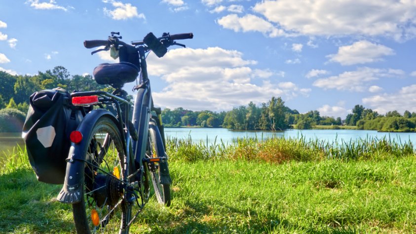 touring bike in flat landscape with lake
