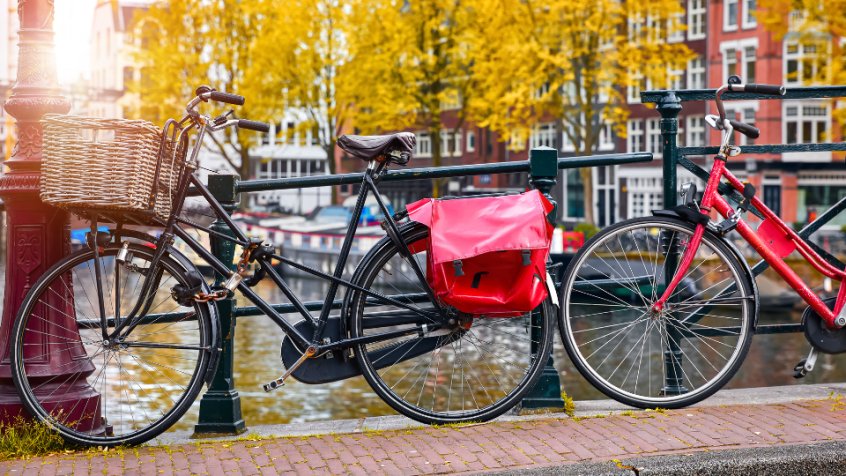 Typical Dutch bikes in a canal in the Netherlands