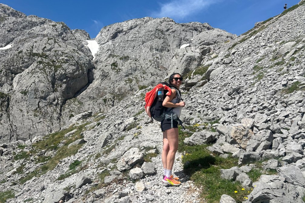 hiker along a stony path in Picos de Europa