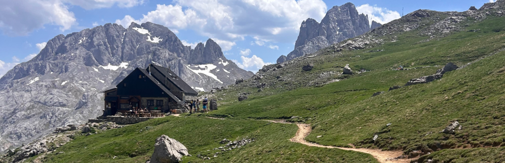 Collado Jermoso hut with Picos de Europa grey peaks behind