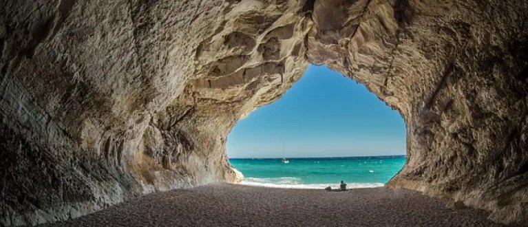 Cave with blue sea in the background in Sardinia