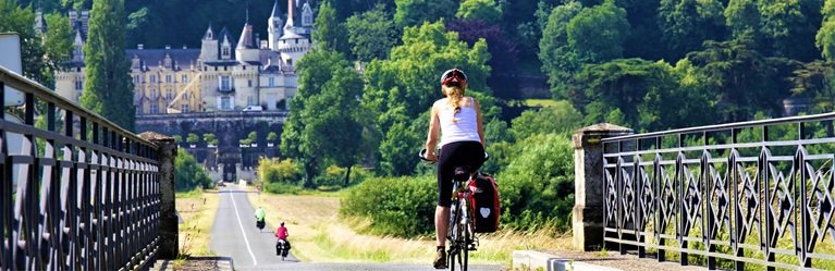 Cyclist crossing a bridge in the Loire Valley