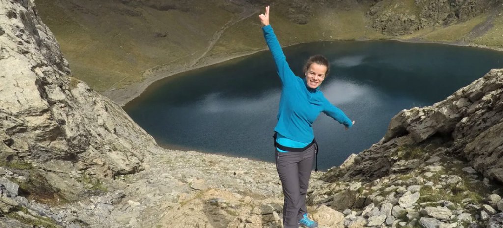 Hiker happy in a lake in the Pyrenees