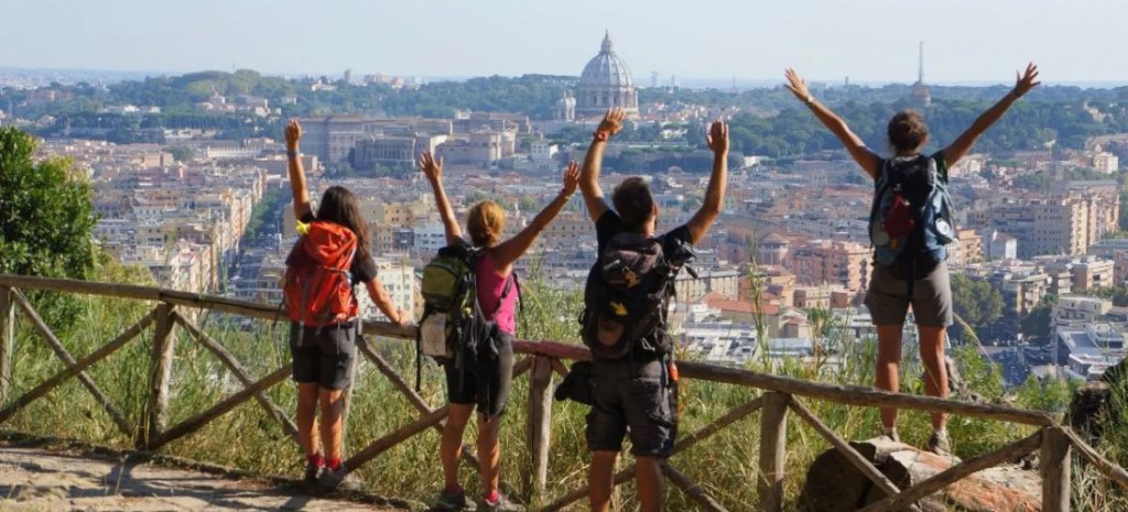 Four pilgrims arriving in Roma along the Via Francigena